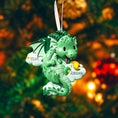 Load image into Gallery viewer, green dragon ornament designed with a fully sculpted 3D front that showcases raised details and expressive features, paired with a smooth 2D flat back for lightweight hanging. The glossy finish enhances the depth of the front design while keeping the back clean and minimal. Personalized name and year placement are clearly visible, making this dragon ornament a magical keepsake and a charming addition to holiday decor or fantasy themed collections.

