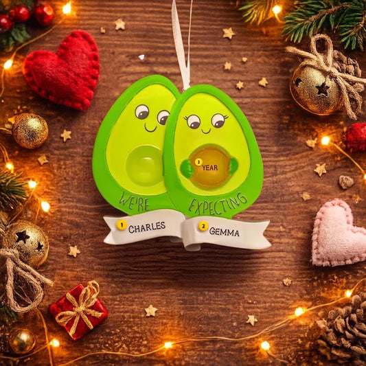 Personalized expecting couple ornament featuring a cute avocado couple design celebrating pregnancy and growing families. This joyful Christmas ornament can be customized with two names and a year, making it perfect for pregnancy announcements, expecting parents, baby reveals, and first Christmas as a family. A playful and heartwarming keepsake that captures love, excitement, and the beginning of a beautiful new chapter together.