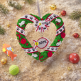 Load image into Gallery viewer, Personalized kitty Christmas ornament designed as a festive heart shaped wreath decorated with cat paw prints fish details and cozy holiday accents. The ornament includes a hanging heart tag that can be personalized with your cat’s name and year. Styled in a warm Christmas setting with soft snow texture and festive colors making it perfect for cat lovers holiday decor cat memorial keepsake and Christmas tree display.
