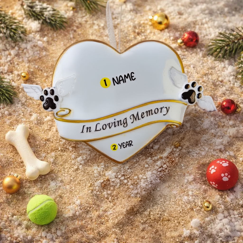 Heart shaped pet memorial Christmas ornament designed to honor the loving memory of a beloved pet. Features angel wing paw details and a soft elegant design that brings comfort and warmth during the holiday season. Includes a customizable name and year area, allowing you to create a meaningful keepsake in remembrance of a cherished companion. Perfect for memorial Christmas trees sympathy gifts pet loss remembrance and heartfelt holiday decor.
