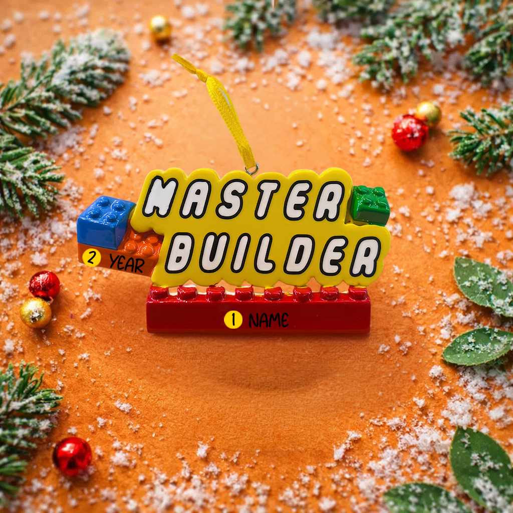Personalized Master Builder Christmas ornament featuring a raised 3D front with colorful building block design and bold lettering. The ornament has a flat 2D back for easy hanging and durability. Bright primary colors and playful block details make it perfect for kids who love building toys. Personalization includes name and year, added by hand, making it a fun and meaningful holiday keepsake for children and young builders.