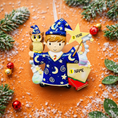 Load image into Gallery viewer, A cute blue-robed wizard boy Christmas ornament featuring a magic wand, star, open book and owl, perfect for kids. Personalized with name and year. Ideal holiday tree decoration for little wizard fans and magical Christmas gifts.
