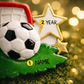 Load image into Gallery viewer, Personalized soccer ornament featuring a detailed goal and ball design with a glossy finish and raised 3D details. The ornament includes one custom name and year displayed on the front. Styled with festive lighting and greenery, this sports themed ornament is perfect for soccer lovers, players, and coaches. Designed with a 3D front and flat back, lightweight and easy to hang on a Christmas tree or display year round.


