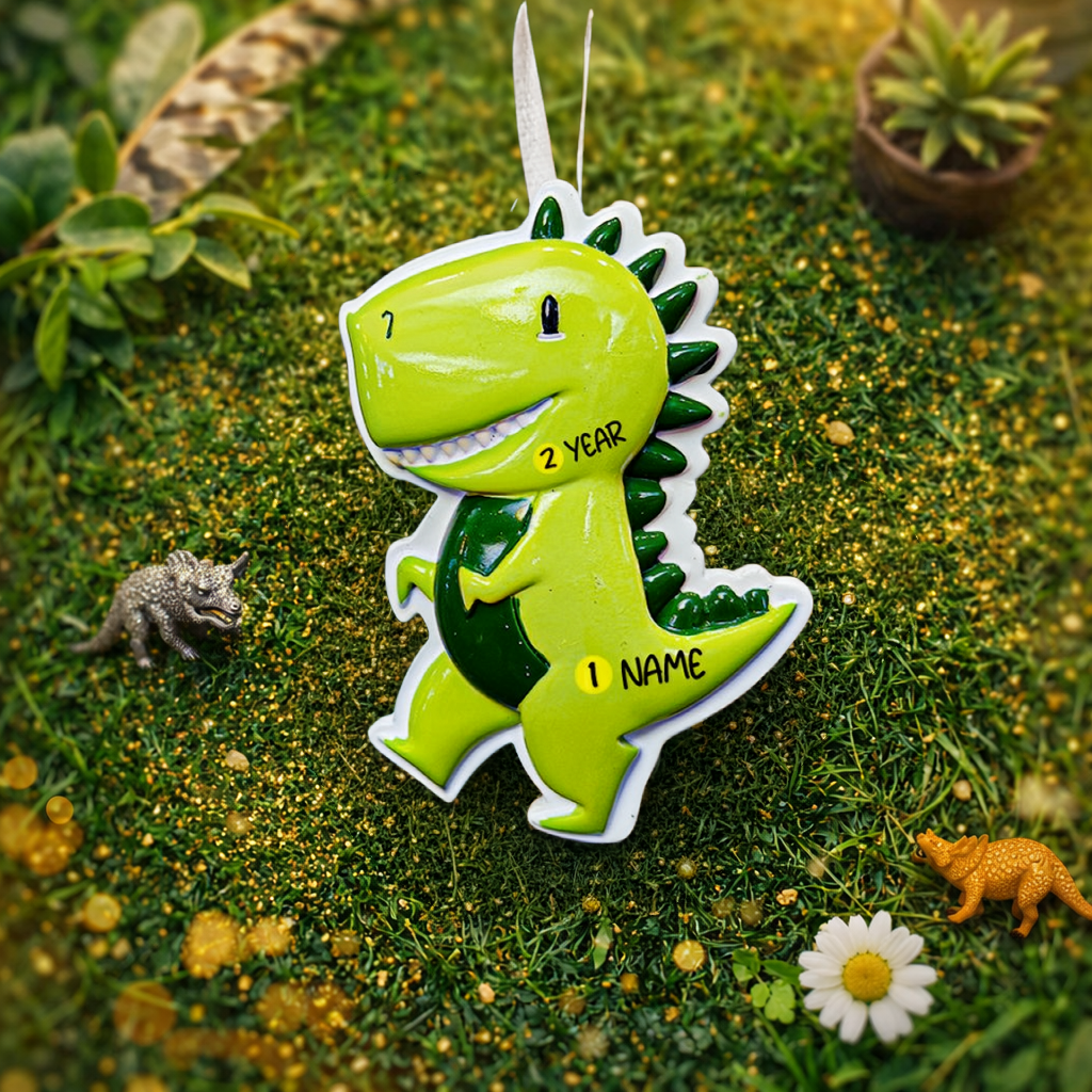 Personalized dinosaur Christmas ornament with a raised 3D front featuring a cute green dinosaur design and glossy detailed texture. The ornament has a flat 2D back for easy hanging and durability. Bright green color, playful smile, and sculpted spikes create a fun and eye catching look. Hand personalized with name and year. Perfect kids Christmas ornament, dinosaur themed holiday decor, and personalized keepsake gift.