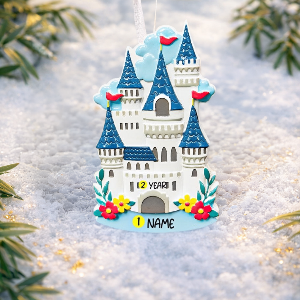 Personalized Princess Castle Christmas Ornament featuring a charming white fairytale castle with blue rooftops and red flags, surrounded by colorful floral details. Customizable with name at the base and year on the castle front, this magical princess castle ornament is perfect for celebrating a special little girl. 