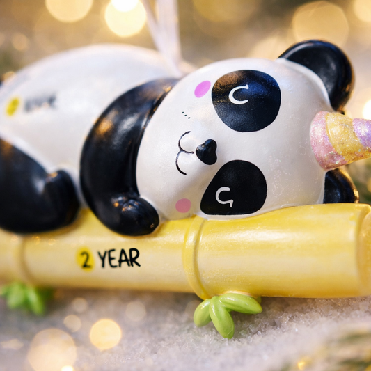 Fully 3D personalized unicorn panda Christmas ornament featuring a sleeping panda resting on a bamboo branch with a pastel unicorn horn. This ornament has a fully sculpted three dimensional front and back with no flat surfaces, creating a playful and premium look. Custom name and year are added by hand. Perfect for kids, panda lovers, unicorn fans, and whimsical holiday decor. A unique 3D keepsake for Christmas trees and seasonal displays.
