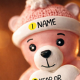 Load image into Gallery viewer, Personalized Pink Teddy Bear Christmas Ornament featuring a sweet baby bear wearing a cozy winter hat and holding a heart that can be customized with a name and year or Baby’s 1st Christmas. This adorable baby girl ornament is designed in soft pink tones, perfect for celebrating a newborn’s first holiday season. A heartwarming keepsake gift for new parents, baby showers, or a special Christmas memory that will be treasured for years to come.
