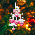 Load image into Gallery viewer, Personalized Baby Girl First Christmas Ornament featuring a dimensional 3D front design with pink glitter bow, heart charms, and hanging cloud detail. The baby’s name is added on the top circle and the year on the cloud, creating a meaningful keepsake. Soft pink tones, layered hearts reading Baby’s First Christmas, and festive holiday accents make it perfect for newborn girl gifts, baby shower presents, and treasured Christmas tree memories.
