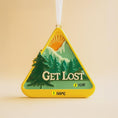 Load image into Gallery viewer, Triangle-shaped ornament with mountain design and 'Get Lost' text on a beige background
