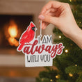 Load image into Gallery viewer, Personalized memorial cardinal ornament featuring a vibrant red cardinal bird perched above the heartfelt phrase I am always with you. Designed with a smooth glossy finish and raised 3D details, this ornament symbolizes remembrance, love, and spiritual connection. Includes free handwritten personalization with one name and year added by OrnamentLab. Styled in a warm holiday setting with soft lights and festive decor, this keepsake ornament is perfect for honoring loved ones who are forever remembered during
