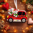 Load image into Gallery viewer, Personalized Christmas ornament featuring two polar bears wearing Santa hats riding in a red car decorated with colorful holiday lights. The ornament includes custom name personalization on each bear and a year displayed on the car. Designed with a detailed 3D raised front and smooth glossy finish, it is made for easy hanging on a Christmas tree. Perfect for festive holiday decor, couple ornaments, family keepsakes, and seasonal gift giving.
