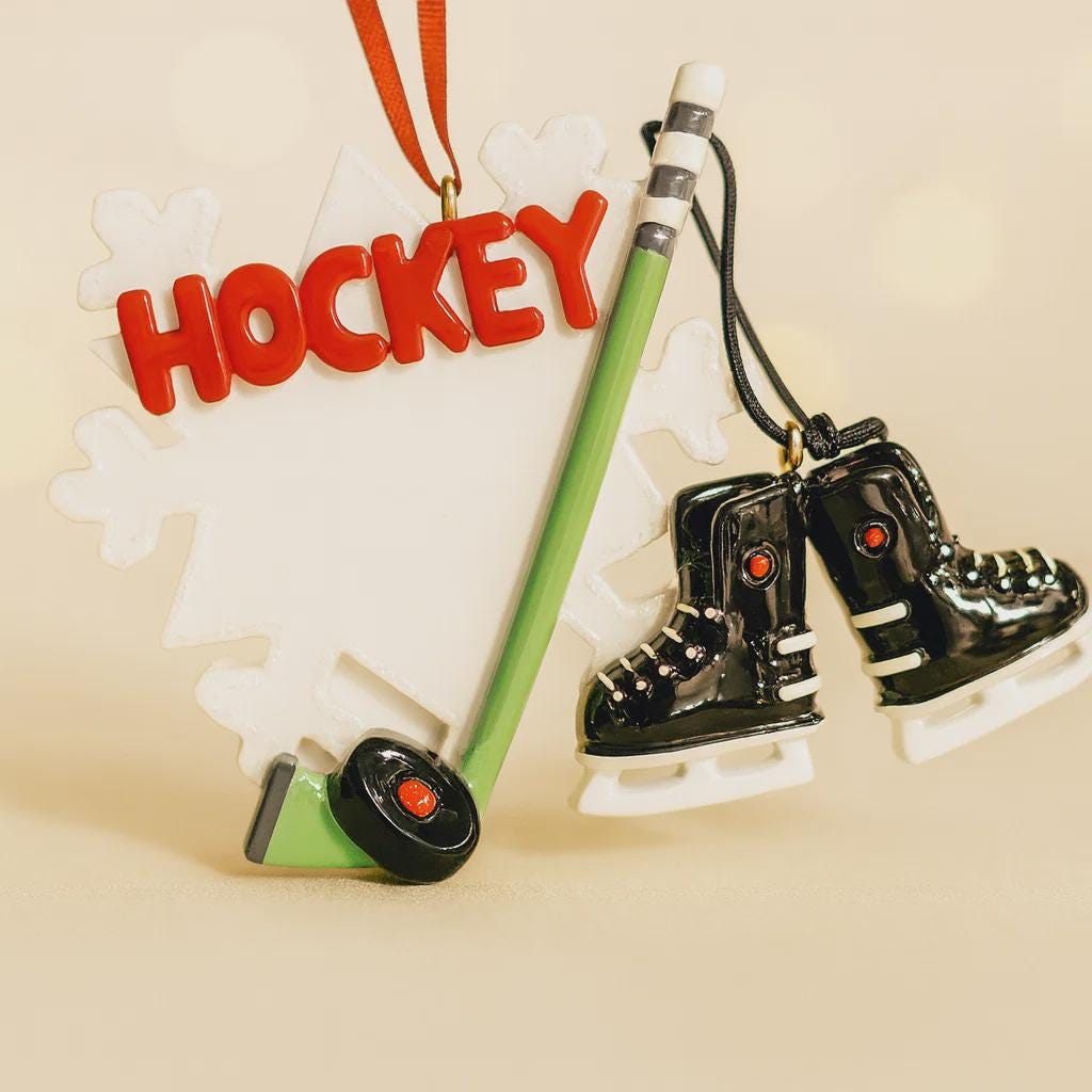 Hockey-themed ornament with 'HOCKEY' text, hockey stick, and skates on a beige background