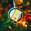 Load image into Gallery viewer, Decorative ornament with smartphone and music app icon on a blurred Christmas tree background

