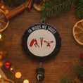 Load image into Gallery viewer, Personalized weightlifting and fitness Christmas ornament featuring a raised 3D front with bold circular design and red strength icons including boxing, gymnastics rings, and weightlifting. The ornament has a textured black outer rim and a flat 2D back for easy hanging. Includes a hanging kettlebell charm for added depth and movement. Hand-added personalization allows a name and year or family name. Photographed on a festive Christmas tree background with warm holiday lights.

