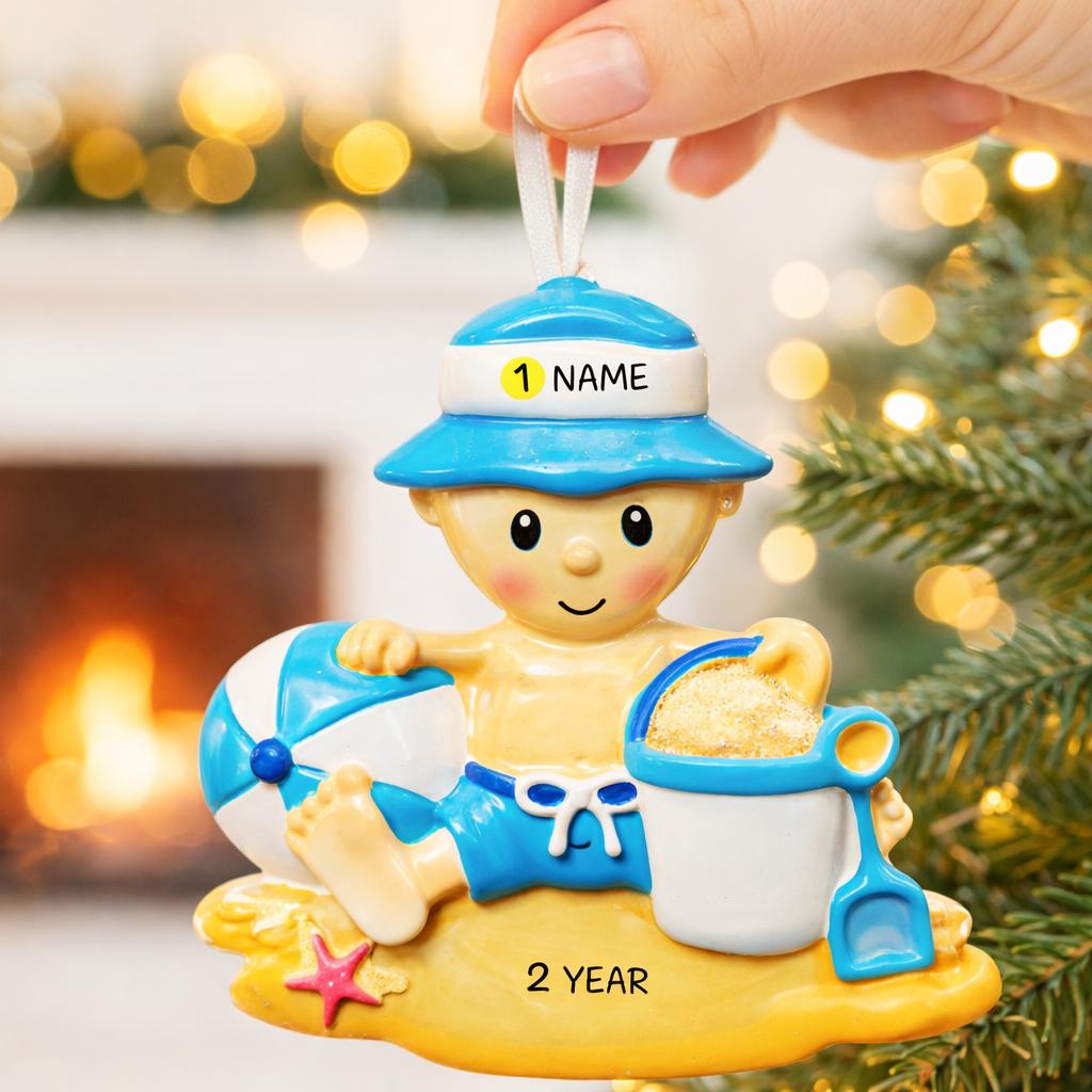 Personalized Beach Baby Christmas Ornament featuring a cheerful toddler sitting on the sand with a beach hat, float, bucket, and shovel. This detailed 3D front design includes raised elements, bright summer colors, and textured sand base for added depth. The name is placed on the hat and the year on the sandy base. A perfect keepsake for baby’s first beach trip or summer memory, ideal for Christmas tree decor or a thoughtful holiday gift for new parents.