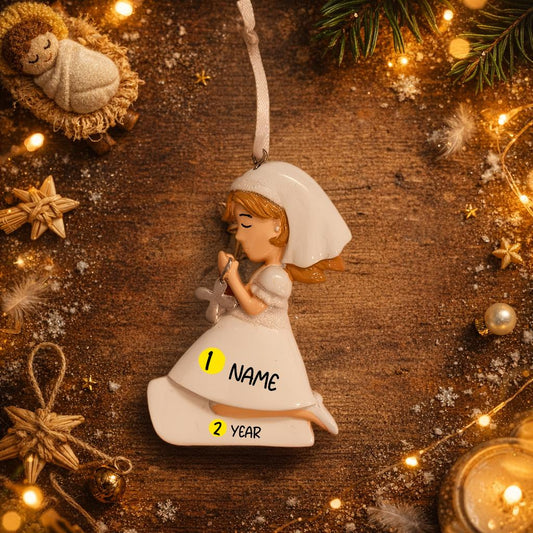 Decorative angel ornament with customizable text on a wooden background with Christmas decorations.