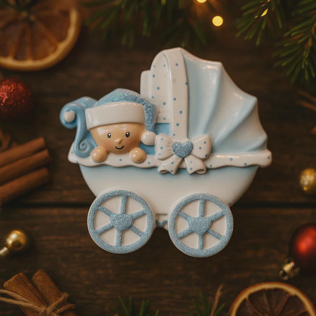 Personalized baby boy Christmas ornament featuring a light blue stroller with glitter details and a smiling baby wearing a blue nightcap. Custom name appears on the top and year on the bottom, making it a perfect Baby’s First Christmas keepsake. This blue resin holiday ornament is ideal for newborn boys, baby shower gifts, and celebrating a special first Christmas memory.