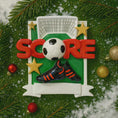 Load image into Gallery viewer, Soccer-themed Christmas ornament with 'SCORE' text, soccer ball, and boot on a green background.
