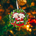 Load image into Gallery viewer, Christmas ornament with couple in a wreath against a blurred festive background
