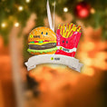 Load image into Gallery viewer, Decorative ornament with a cartoon hamburger and fries on a blurred festive background
