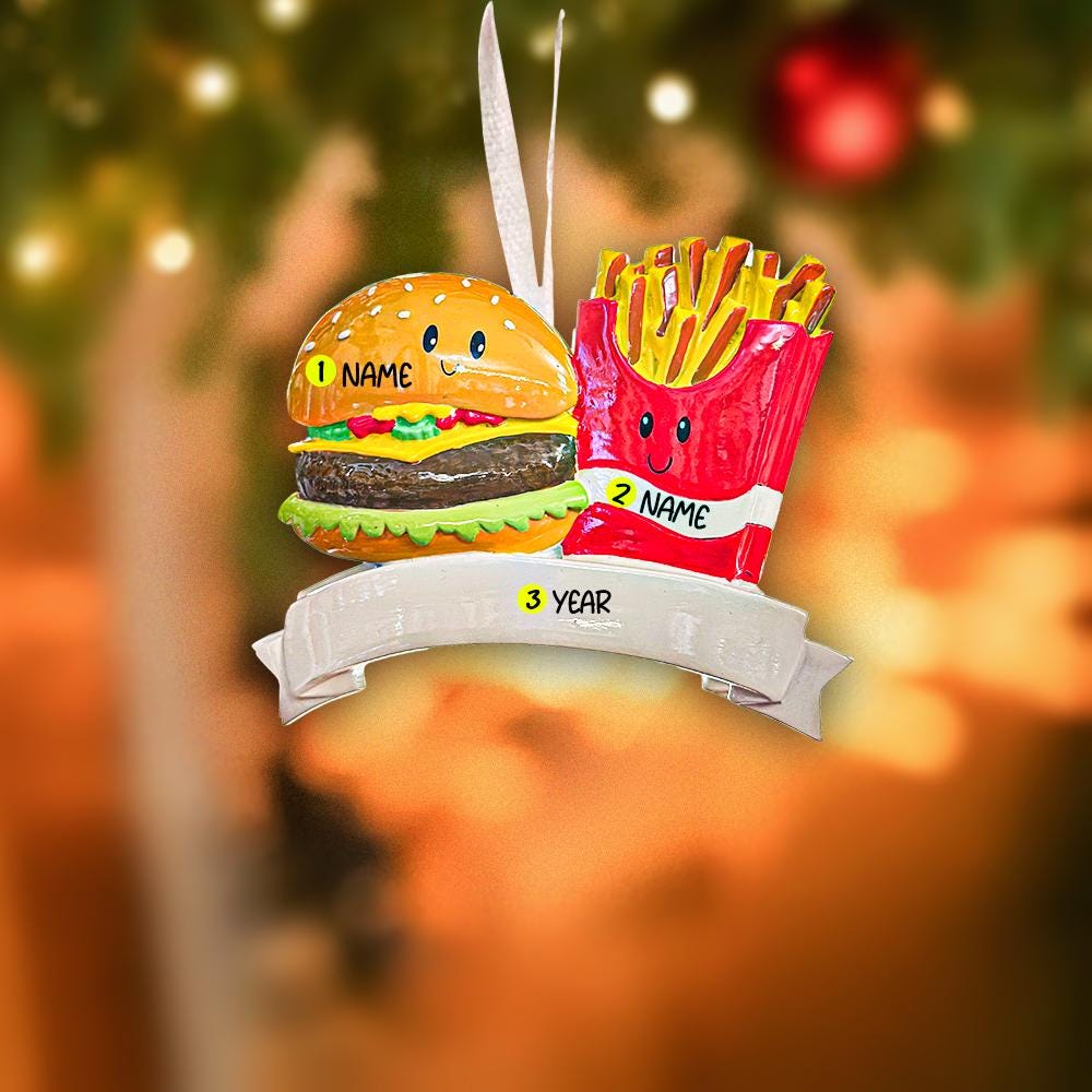 Decorative ornament with a cartoon hamburger and fries on a blurred festive background