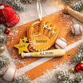 Load image into Gallery viewer, Personalized baseball glove Christmas ornament featuring a tan baseball glove with stitched details, customizable name area on the glove, customizable year star, and customizable text on the baseball bat, glossy finish with raised 3D front details and flat 2D back, white satin hanging ribbon, displayed on a snowy baseball field themed holiday background with baseballs and pine branches.
