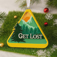 Load image into Gallery viewer, Decorative ornament with 'GET LOST' text on a green background, hanging on a tree.
