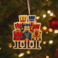 Load image into Gallery viewer, Christmas ornament with nutcrackers on a decorated tree
