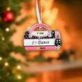 Load image into Gallery viewer, Decorative ornament shaped like a pink ballet slipper with 'I ❤️ Dance' text, on a blurred Christmas tree background.
