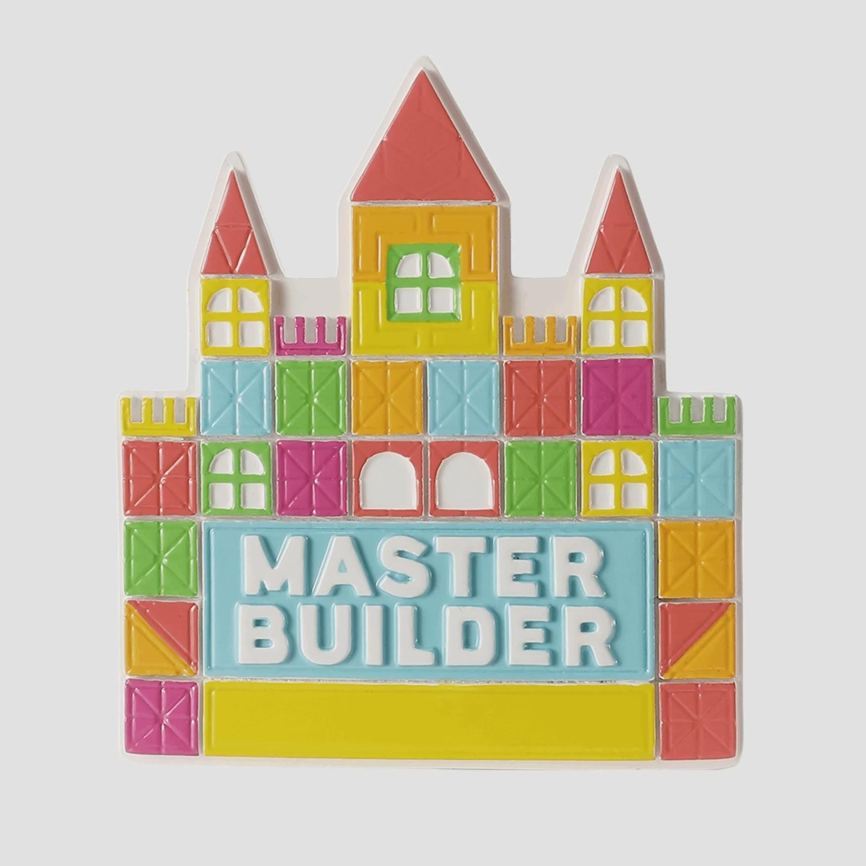 Colorful toy castle with 'Master Builder' text on a white background