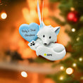 Load image into Gallery viewer, Decorative arctic fox ornament with 'Baby's First Christmas' heart and customizable name tag against a festive background.
