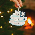 Load image into Gallery viewer, Decorative Christmas ornament with polar bears on a tree with warm glow
