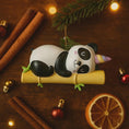 Load image into Gallery viewer, Fully 3D personalized unicorn panda Christmas ornament featuring a sleeping panda resting on a bamboo branch with a pastel unicorn horn. This ornament has a fully sculpted three dimensional front and back with no flat surfaces, creating a playful and premium look. Custom name and year are added by hand. Perfect for kids, panda lovers, unicorn fans, and whimsical holiday decor. A unique 3D keepsake for Christmas trees and seasonal displays.

