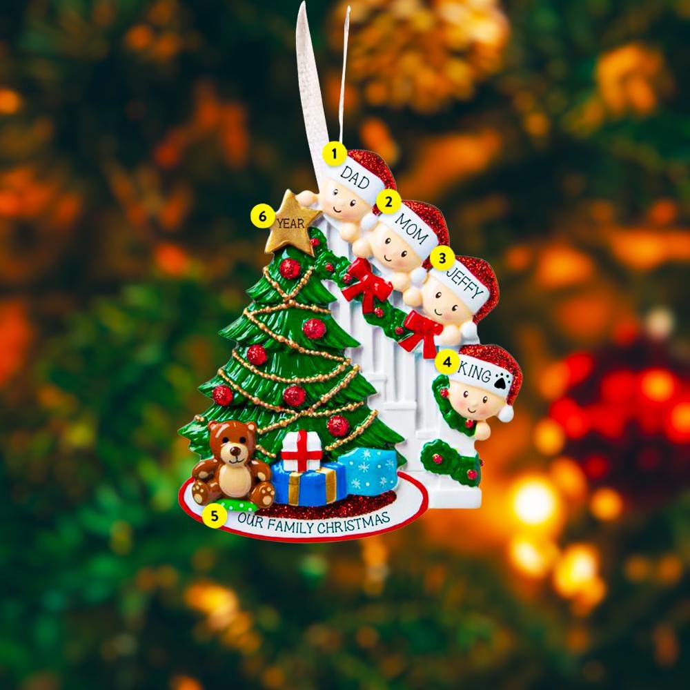 Personalized family Christmas ornament with four children around a Christmas tree on a blurred festive background.