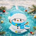 Load image into Gallery viewer, Personalized Snowman Baby Christmas Ornament featuring a cheerful snowman with blue glitter hat and scarf, holding a sparkling ornament. This design has a raised 3D front with textured details, dimensional elements, and vibrant winter colors. The child’s name is placed on the scarf and the year is added below. A perfect keepsake for baby’s first Christmas, newborn gift, winter holiday decoration, and meaningful family tree memory ornament.
