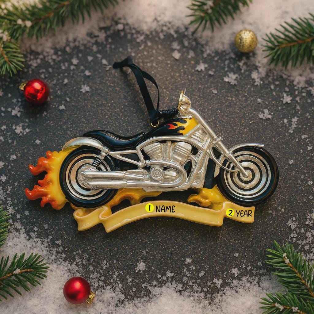 Motorcycle ornament with flames on a textured surface with Christmas decorations