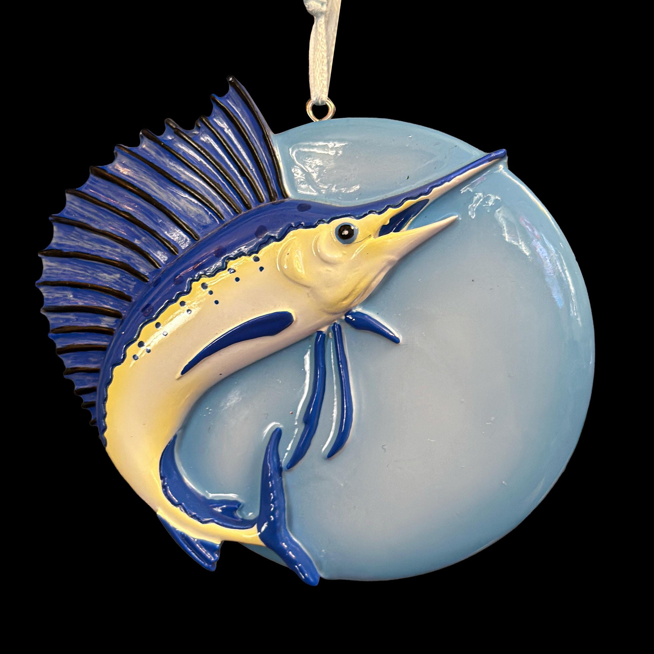 Decorative ornament with a  Sailfish design on a black background