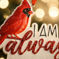 Load image into Gallery viewer, Personalized memorial cardinal ornament featuring a vibrant red cardinal bird perched above the heartfelt phrase I am always with you. Designed with a smooth glossy finish and raised 3D details, this ornament symbolizes remembrance, love, and spiritual connection. Includes free handwritten personalization with one name and year added by OrnamentLab. Styled in a warm holiday setting with soft lights and festive decor, this keepsake ornament is perfect for honoring loved ones who are forever remembered during

