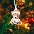 Load image into Gallery viewer, Personalized Pink Teddy Bear Christmas Ornament featuring a sweet baby bear wearing a cozy winter hat and holding a heart that can be customized with a name and year or Baby’s 1st Christmas. This adorable baby girl ornament is designed in soft pink tones, perfect for celebrating a newborn’s first holiday season. A heartwarming keepsake gift for new parents, baby showers, or a special Christmas memory that will be treasured for years to come.
