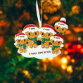 Load image into Gallery viewer, Gingerbread family ornament with customizable names against a blurred Christmas tree background
