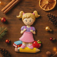 Load image into Gallery viewer, Decorative figurine of a girl on a pencil with Christmas decorations on a wooden surface
