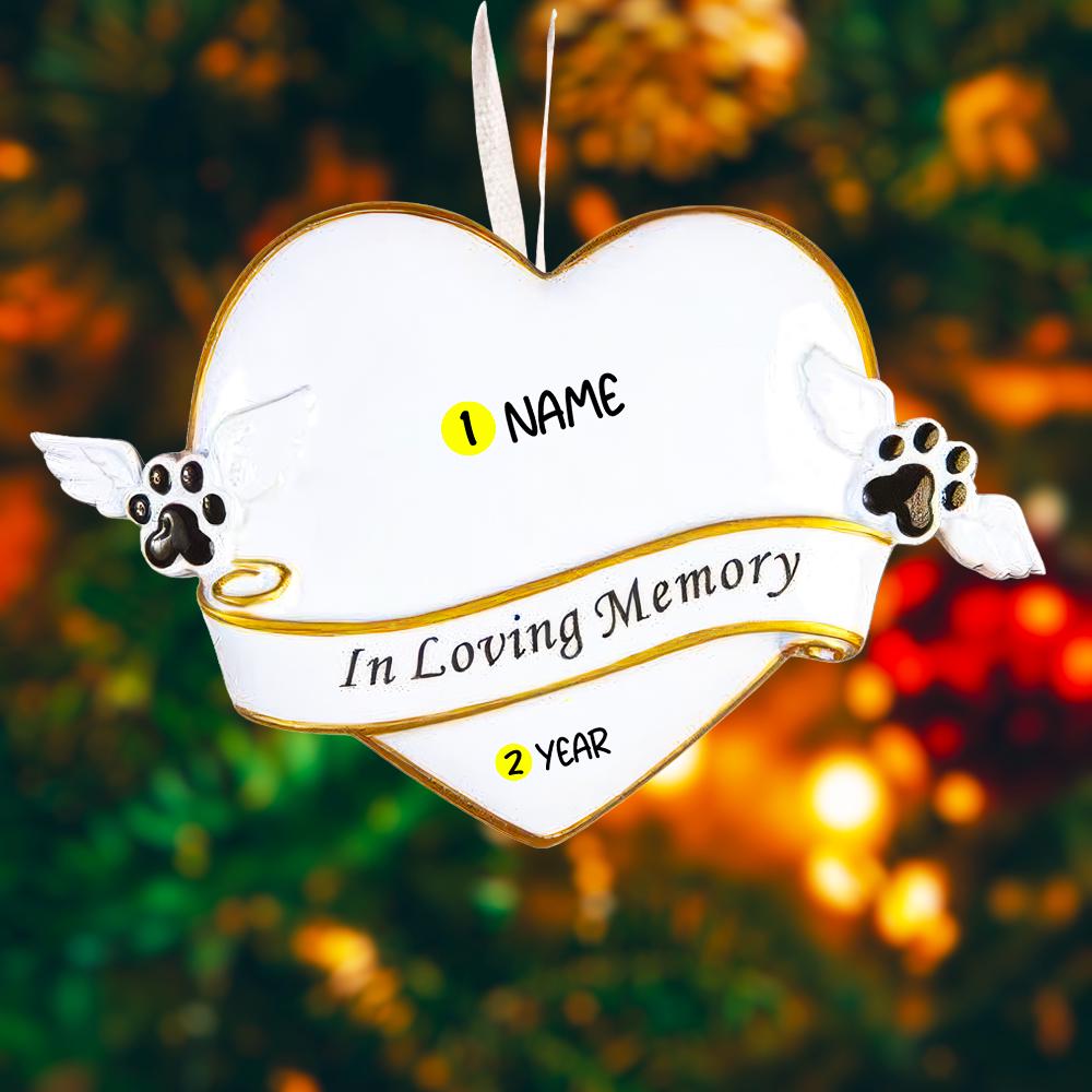 Heart shaped pet memorial Christmas ornament designed to honor the loving memory of a beloved pet. Features angel wing paw details and a soft elegant design that brings comfort and warmth during the holiday season. Includes a customizable name and year area, allowing you to create a meaningful keepsake in remembrance of a cherished companion. Perfect for memorial Christmas trees sympathy gifts pet loss remembrance and heartfelt holiday decor.