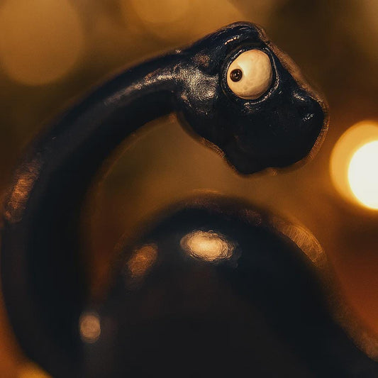 Personalized dinosaur Christmas ornament with custom name and year, dark blue long neck dino holiday keepsake