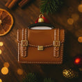 Load image into Gallery viewer, brown briefcase ornament on a green surface with Christmas decorations
