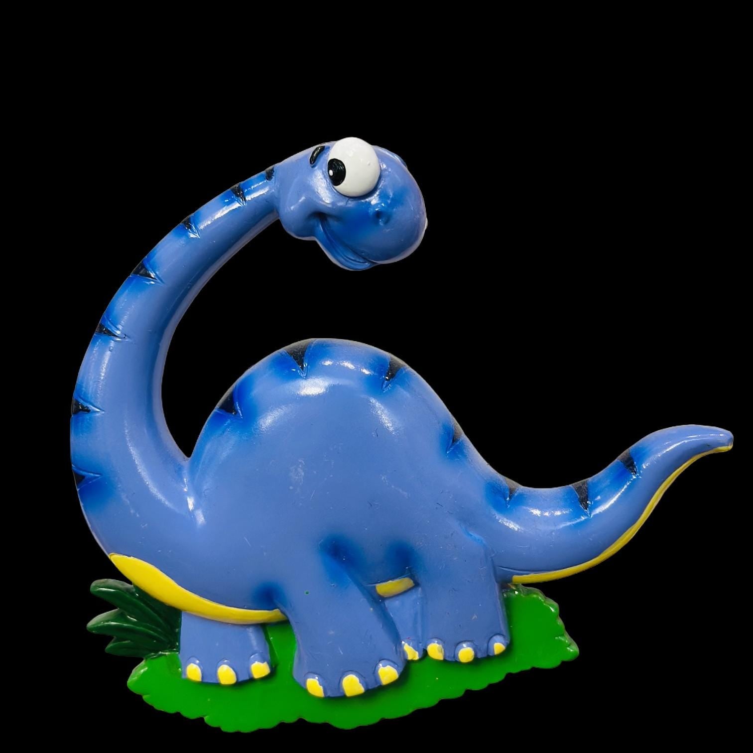 Blue dinosaur toy on a black background