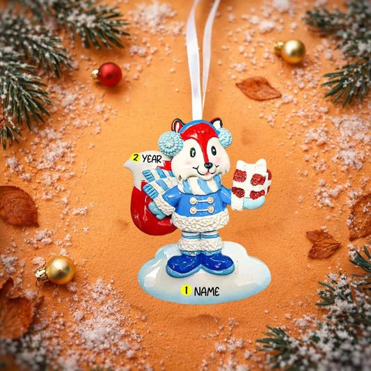 Decorative Christmas ornament with a character fox holding a candy cane on a snowy background.