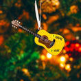 Load image into Gallery viewer, Personalized guitar ornament featuring a classic acoustic guitar design with detailed strings and wood texture. Custom name and year handwritten directly on the guitar body. High detail 3D resin ornament with white hanging ribbon. Perfect Christmas tree decoration for guitar players musicians music lovers and acoustic guitar fans. Warm musical theme ideal for holiday decor and meaningful personalized gifts.
