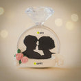 Load image into Gallery viewer, Decorative item with silhouettes of a couple, flowers, and text on a beige background
