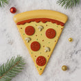 Load image into Gallery viewer, Decorative pizza slice ornament on a marble surface with Christmas decorations.
