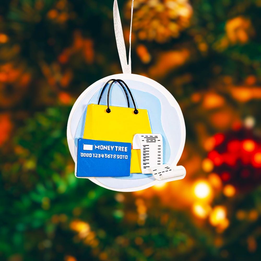 A modern money themed ornament featuring a shopping bag, a credit card detail, and a receipt element, designed to represent budgeting, spending habits, and financial milestones in a fun and playful way. The ornament showcases a raised 3D front with clean sculpted details and a glossy finish, combined with a flat 2D back for smooth and balanced hanging. Made from durable resin and presented as a clean cutout style visual, this ornament is a perfect gift choice for finance lovers, shoppers, accountants, entre